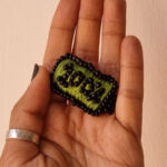 100%-brooch