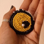 yellow evil eye brooch